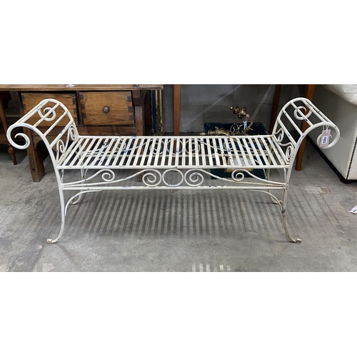 1023 - A painted wrought iron scroll end garden bench, length 130cm, depth 34cm, height 61cm