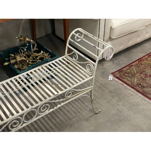 1023 - A painted wrought iron scroll end garden bench, length 130cm, depth 34cm, height 61cm