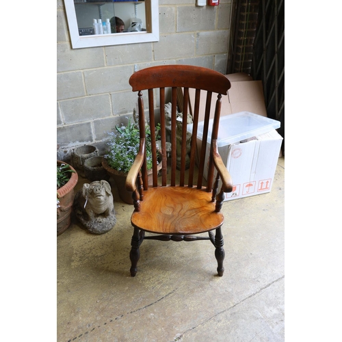 1037 - A Victorian elm and beech Windsor lathe back armchair.