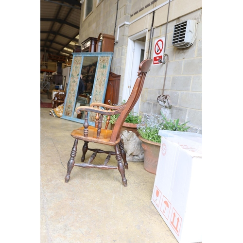 1037 - A Victorian elm and beech Windsor lathe back armchair.