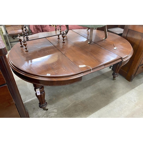 1041 - A Victorian mahogany extending dining table, length 170cm extended (two spare leaves), width 119cm, ... 