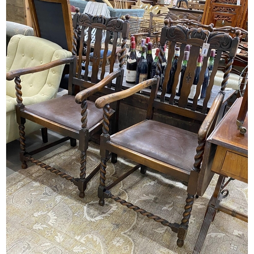 1046 - A pair of 1930s carved beech Carolean style elbow chairs