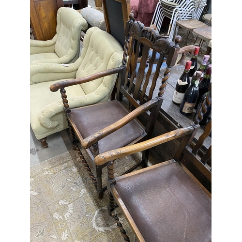 1046 - A pair of 1930s carved beech Carolean style elbow chairs