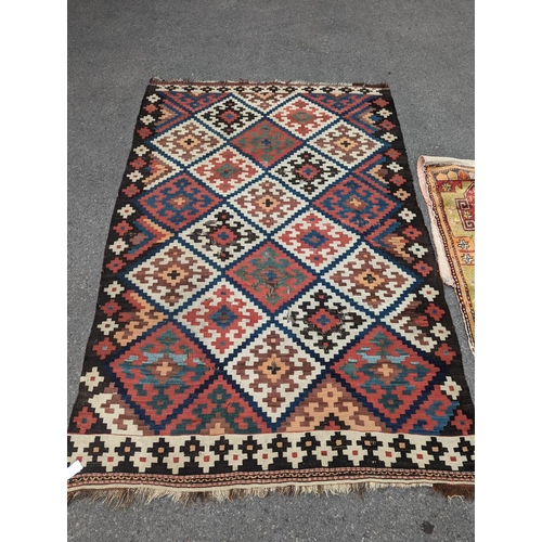 1048 - A Persian tribal Kelim carpet, 230 x 158cm and a Turkish bag