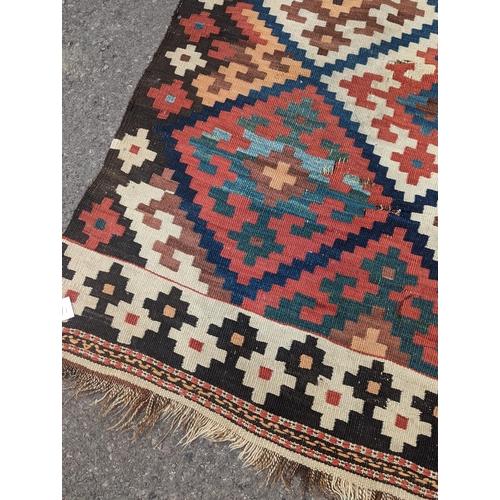 1048 - A Persian tribal Kelim carpet, 230 x 158cm and a Turkish bag