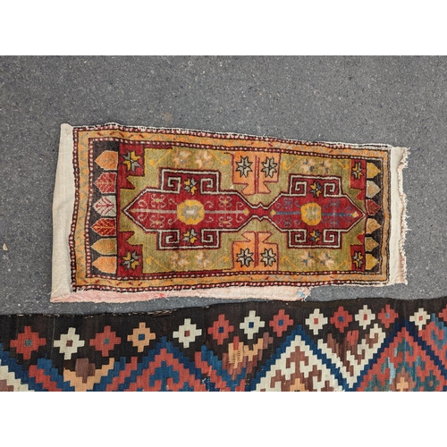 1048 - A Persian tribal Kelim carpet, 230 x 158cm and a Turkish bag