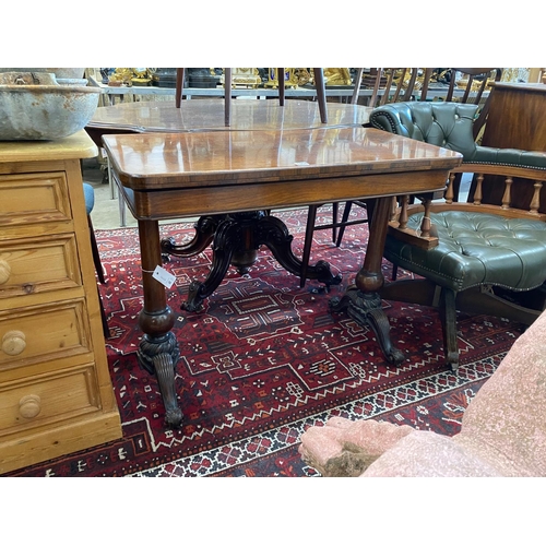 1054 - A Victorian rectangular rosewood folding card table, width 92cm, depth 46cm, height 73cm... 