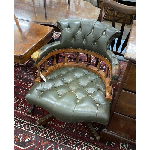 1055 - A Victorian style green leather, stained beech swivel desk chair, width 63cm, depth 57cm, height 80c... 