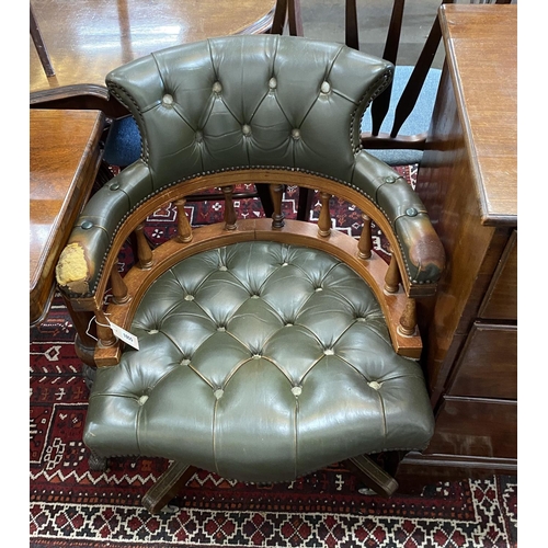 1055 - A Victorian style green leather, stained beech swivel desk chair, width 63cm, depth 57cm, height 80c... 