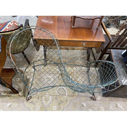 1073 - A painted wrought iron and wirework garden love seat, width 126cm, depth 50cm, height 90cm... 