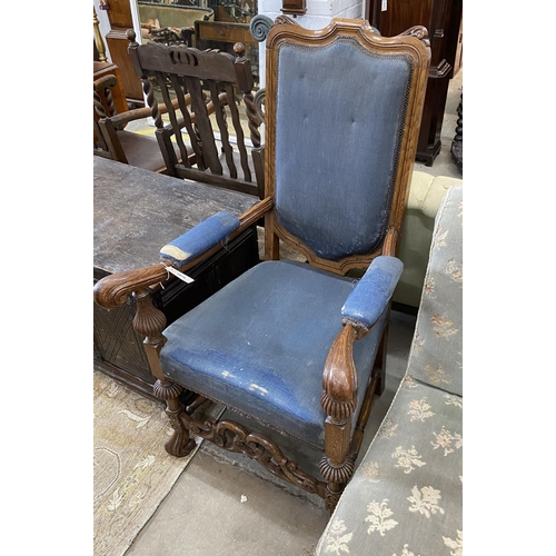 1075 - A Carolean style oak upholstered open armchair, width 65cm, depth 55cm, height 118cm