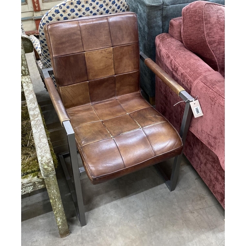 1095 - A modern chrome and tan leather desk chair, width 56cm, depth 56cm, height 85cm