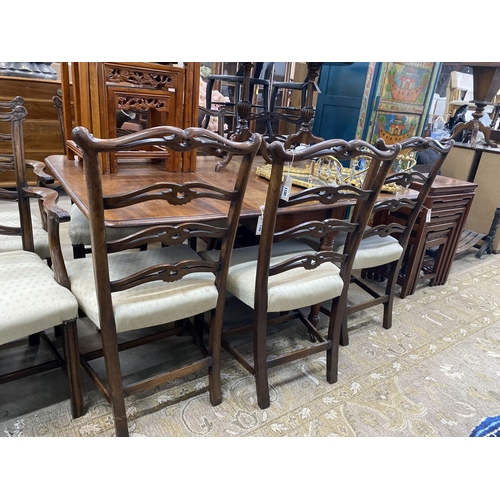 1100 - A set of six Chippendale style mahogany dining chairs with pierced ladder backs, two with arms... 