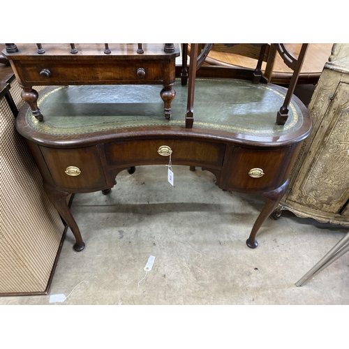 1114 - A 1920's kidney shaped writing table, width 110cm, depth 50cm, height 78cm