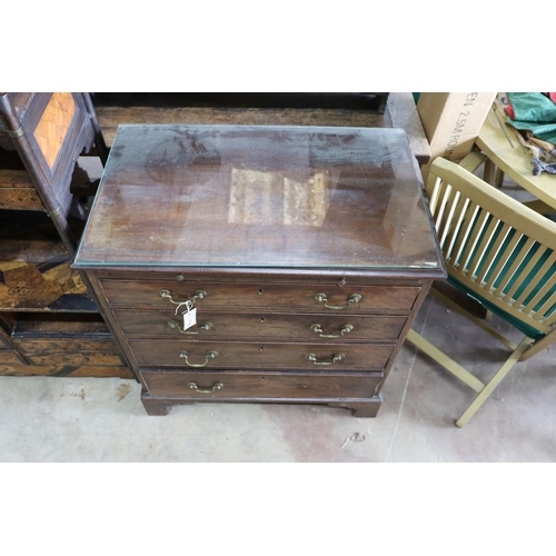 1118 - A small George III mahogany chest of three graduating long drawers and fitted slide, width 79cm, dep... 