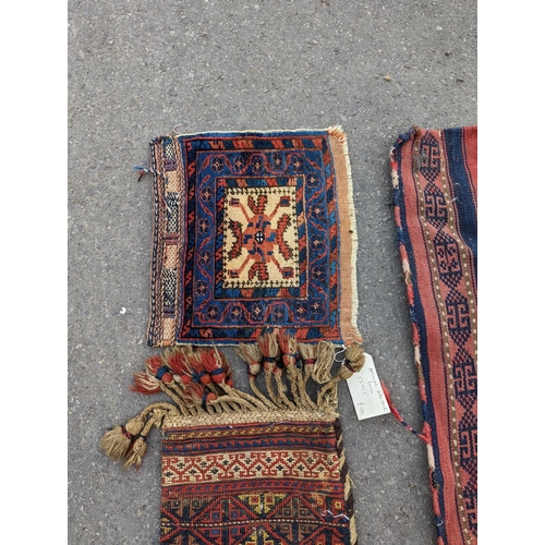 1126 - An Afghan Kilim flatweave saddlebag, 144 x 69cm together with six assorted bags, faces, etc.... 