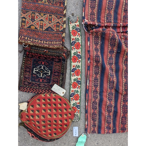 1126 - An Afghan Kilim flatweave saddlebag, 144 x 69cm together with six assorted bags, faces, etc.... 