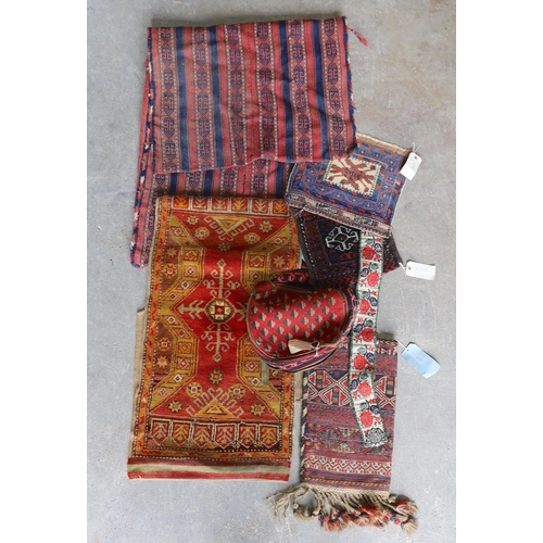 1126 - An Afghan Kilim flatweave saddlebag, 144 x 69cm together with six assorted bags, faces, etc.... 