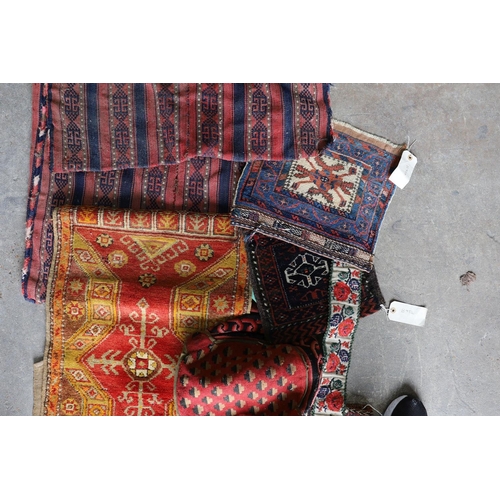 1126 - An Afghan Kilim flatweave saddlebag, 144 x 69cm together with six assorted bags, faces, etc.... 