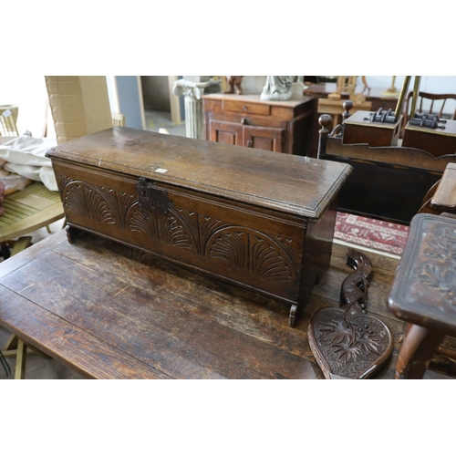 1131 - A 17th century carved oak six plank coffer, W 99, D 36, H 38cms.