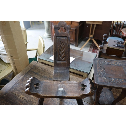 1132 - A small child's oak rocking chair, a pair of carved wood bellows and two caned tables