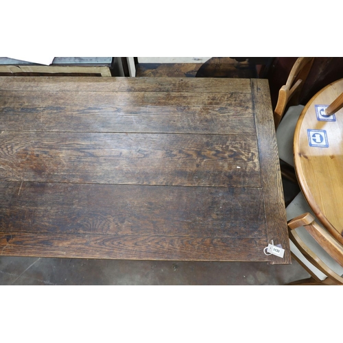 1133 - A rectangular oak cleated planked top refectory dining table, length 165cm, depth 91cm, height 76cm... 