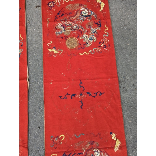 1145 - A pair of Chinese silk embroidered wall hangings, 46 x 152cm