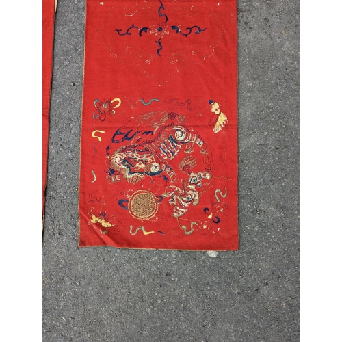 1145 - A pair of Chinese silk embroidered wall hangings, 46 x 152cm