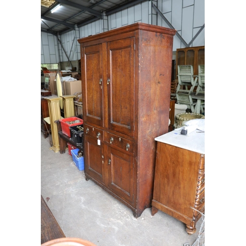 1181 - An early 19th century Welsh panelled oak household cabinet. W 116cm, D 52cm, H 200cm