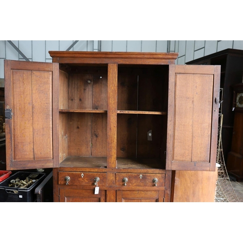 1181 - An early 19th century Welsh panelled oak household cabinet. W 116cm, D 52cm, H 200cm