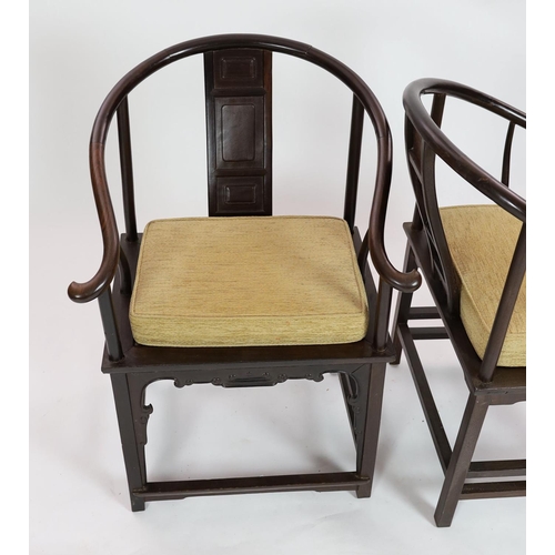 1186 - A pair of Chinese tielimu horseshoe-back armchairs, 18th/19th century,each central panelled back sup... 