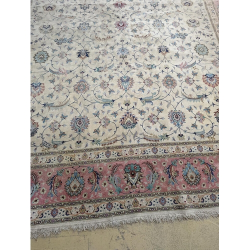 1190 - A Persian Tabriz ivory ground carpet, 410 x 300