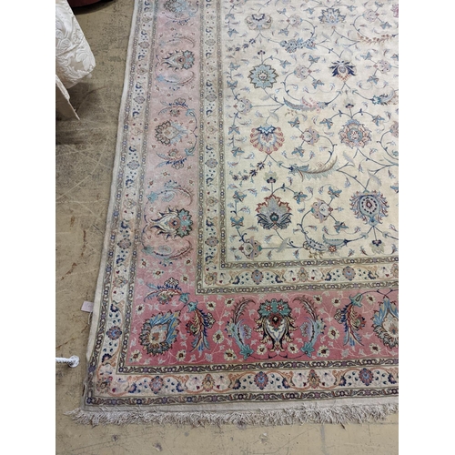 1190 - A Persian Tabriz ivory ground carpet, 410 x 300