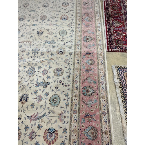 1190 - A Persian Tabriz ivory ground carpet, 410 x 300