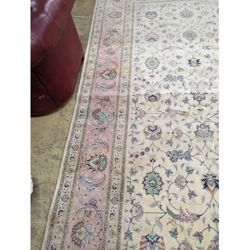 1190 - A Persian Tabriz ivory ground carpet, 410 x 300