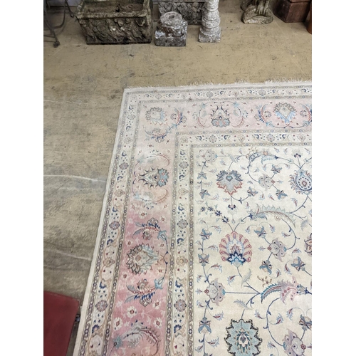 1190 - A Persian Tabriz ivory ground carpet, 410 x 300