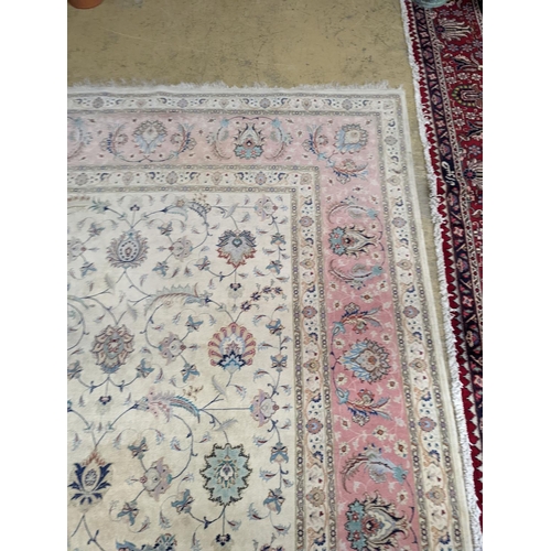 1190 - A Persian Tabriz ivory ground carpet, 410 x 300