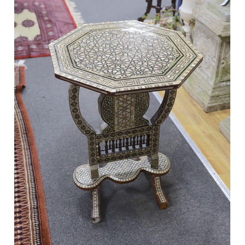 1203 - A Damascusware and mother of pearl inlaid octagonal tilt top table, width 50cm, height 66cm... 