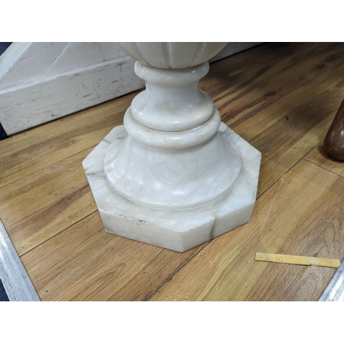 1208 - A carved alabaster pedestal on octagonal base, height 108cm