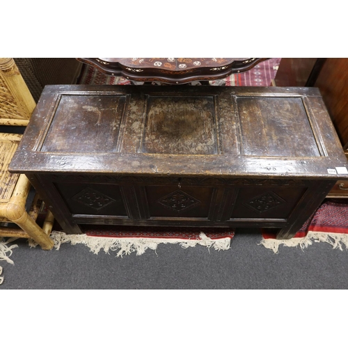 1214 - A late 17th century carved oak coffer, length 134cm, depth 54cm, height 68cm