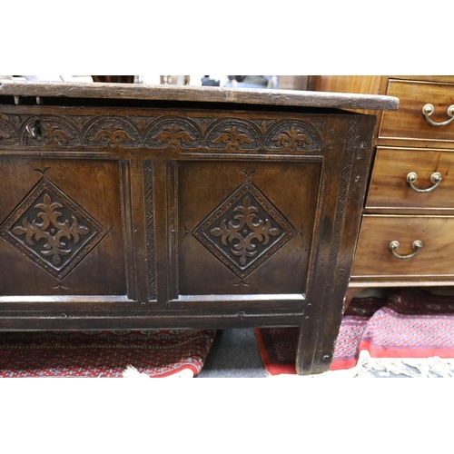 1214 - A late 17th century carved oak coffer, length 134cm, depth 54cm, height 68cm