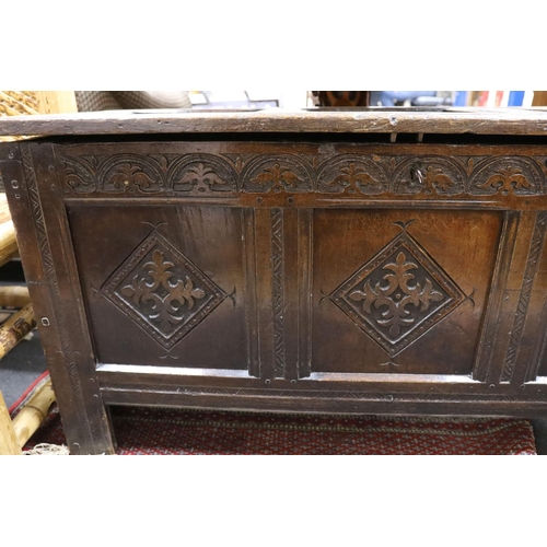 1214 - A late 17th century carved oak coffer, length 134cm, depth 54cm, height 68cm