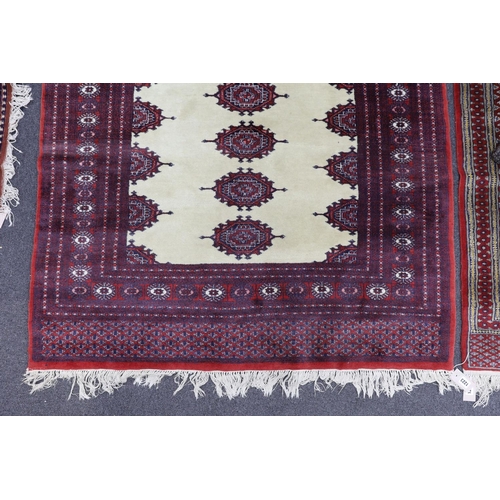 1223 - A Bokhara ivory ground rug, 190 x 125cm