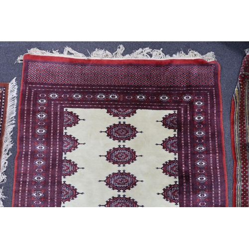 1223 - A Bokhara ivory ground rug, 190 x 125cm