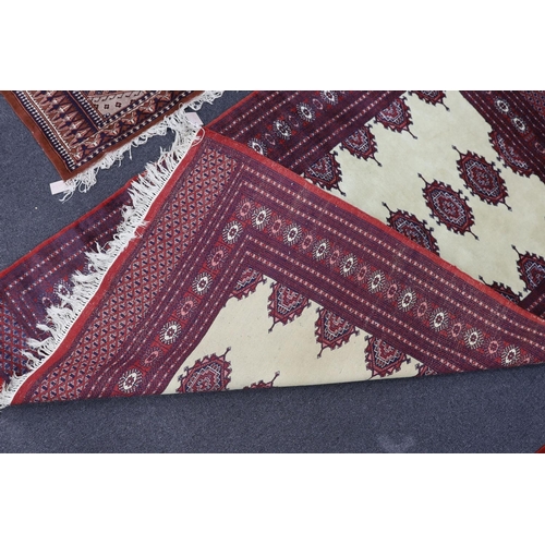 1223 - A Bokhara ivory ground rug, 190 x 125cm