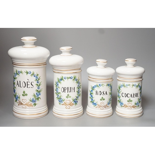 1252 - Four graduated porcelain apothecary jars - tallest 26cm