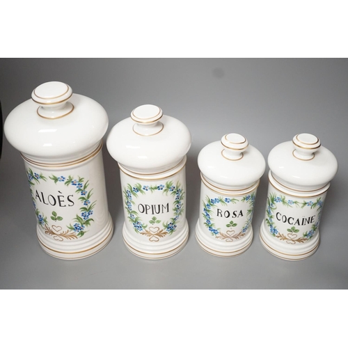 1252 - Four graduated porcelain apothecary jars - tallest 26cm