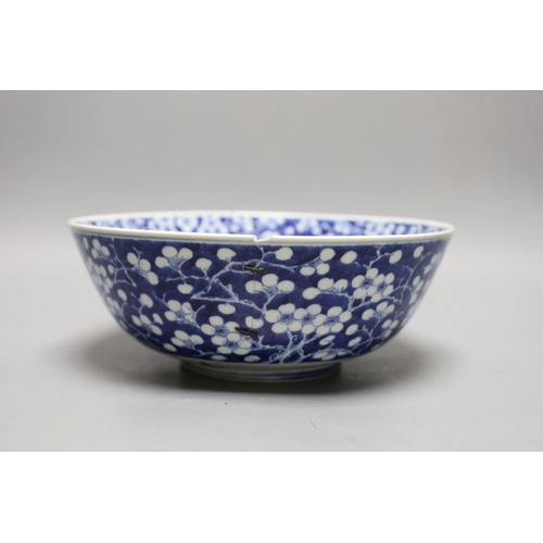 1262 - A Chinese blue and white prunus bowl, 19th century. 26.5cm diameter