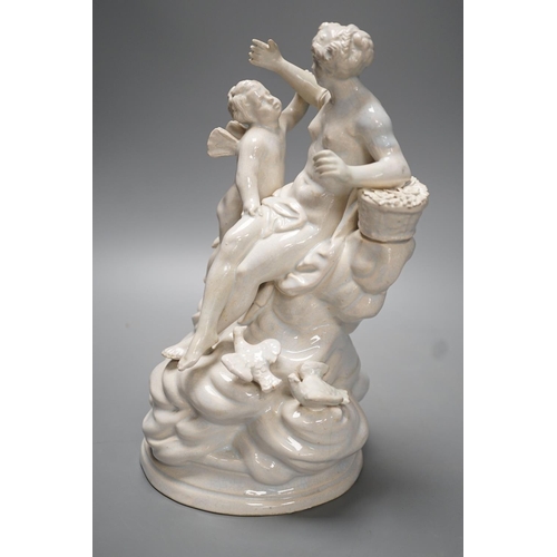 1263 - A 19th century Naples style maiolica group of Venus and Cupid - 26.5cm high