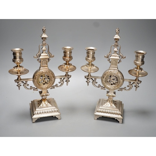 1264 - A pair of Winn & Co., Birmingham silvered brass two branch candelabra - 28.9cm high